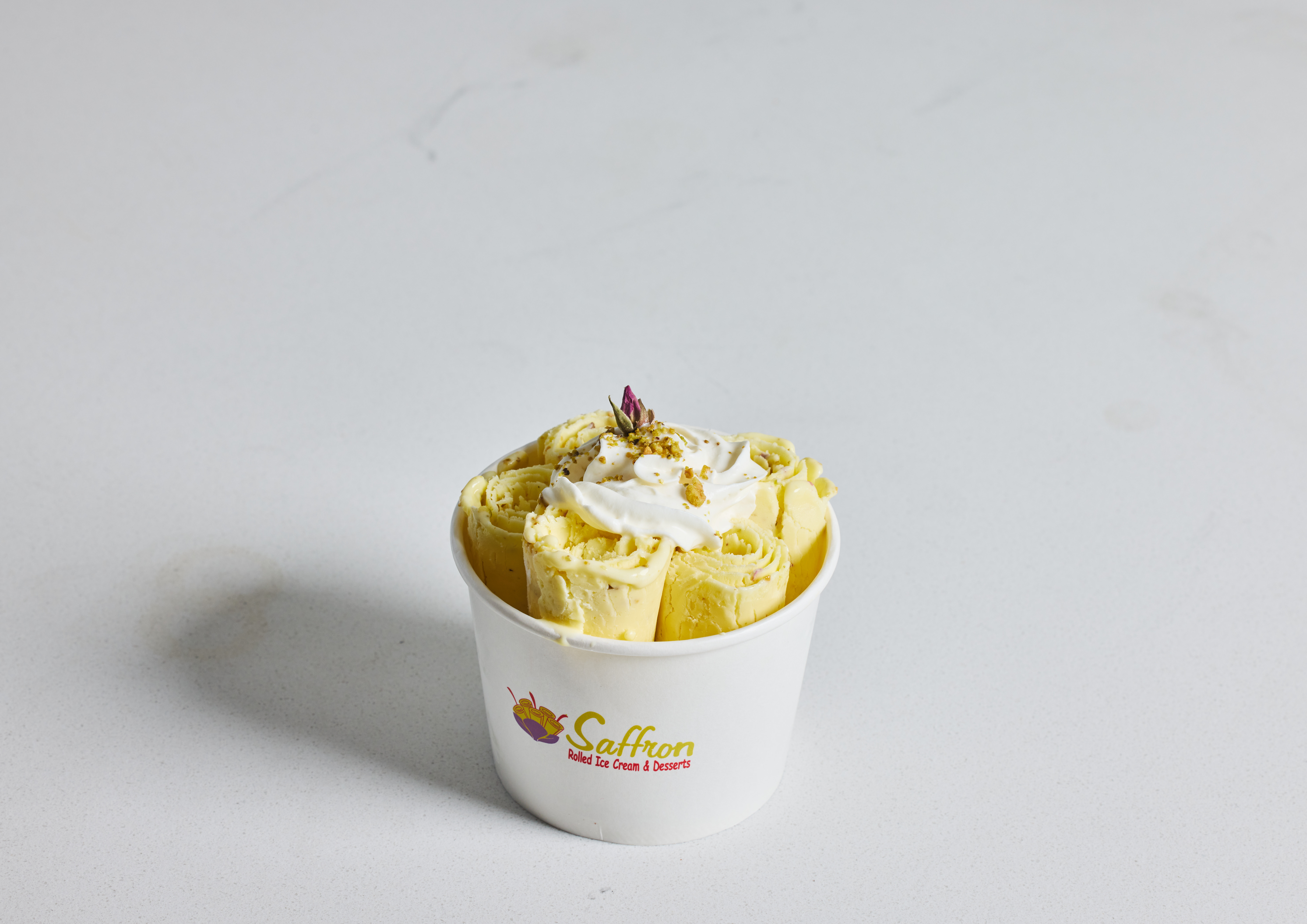Saffron rolled ice cream dessert